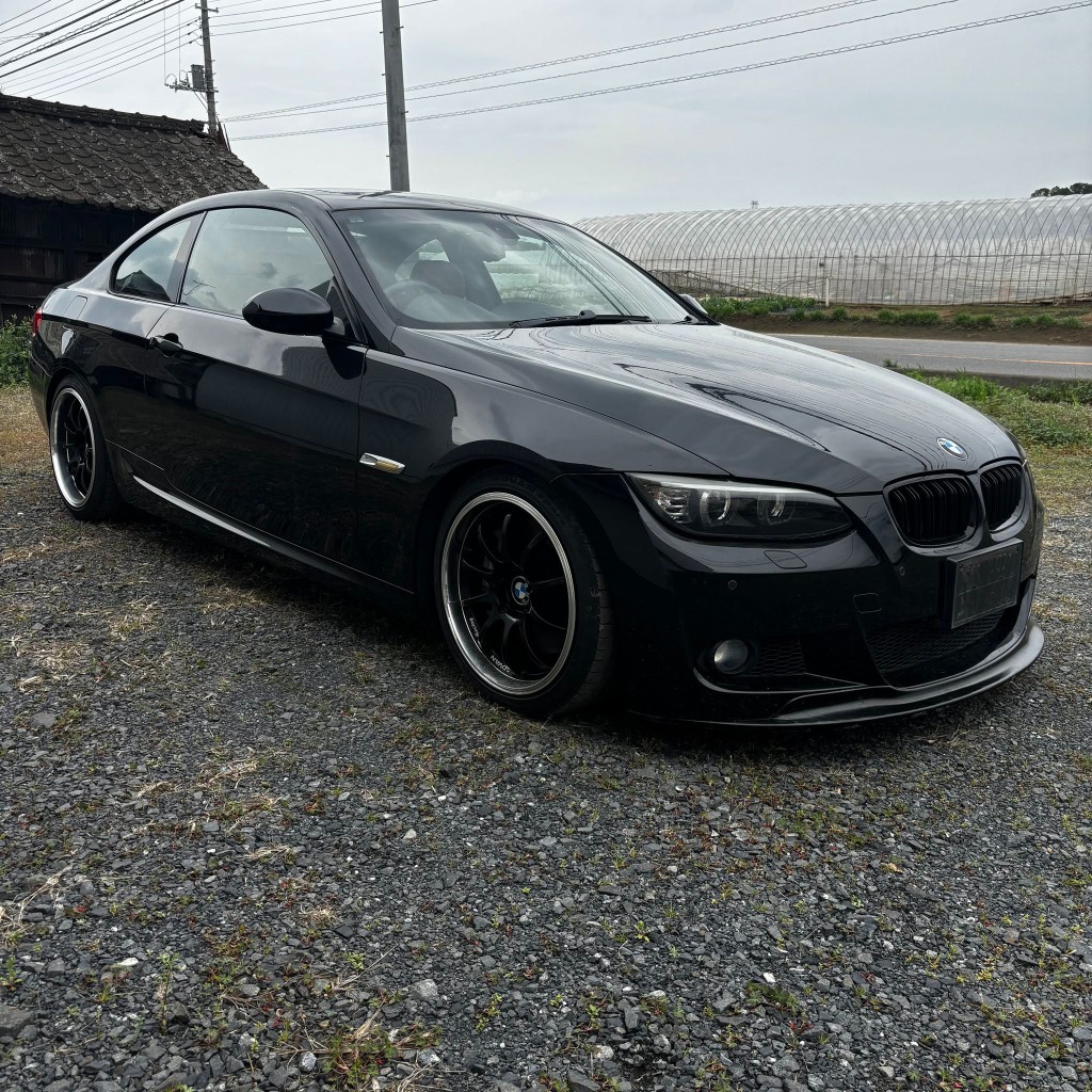 Black BMW coupe at a Japanese auction yard before import