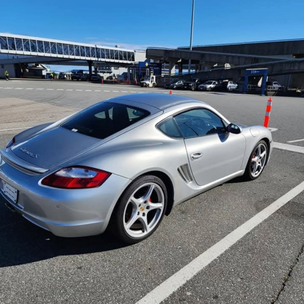 Silver Porsche Cayman S at Vancouver ferry terminal ready for pickup