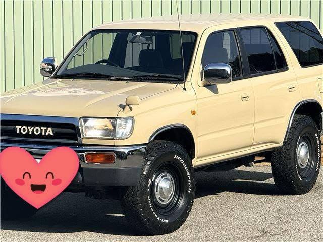 Tan Toyota Hilux Surf JDM SUV at a dealer lot in Japan before export