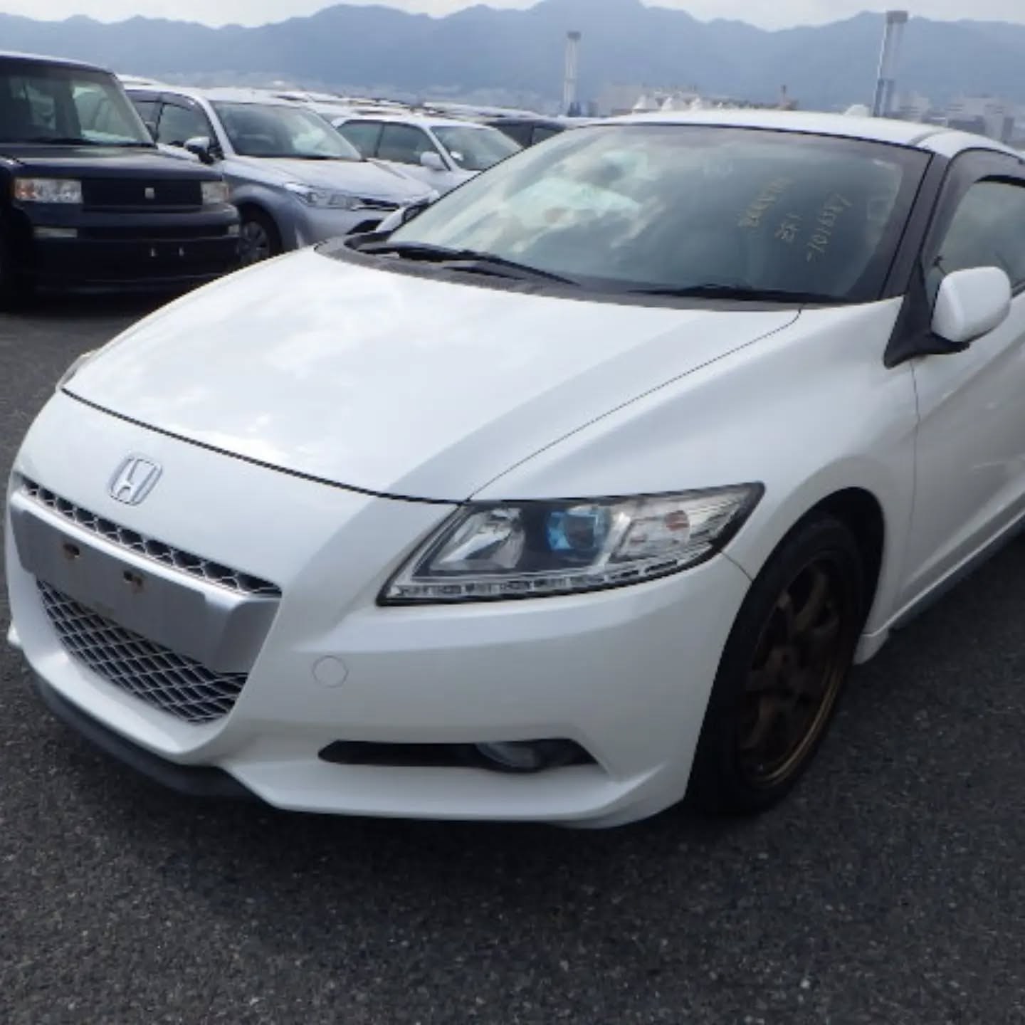 White Honda CR-Z with bronze wheels imported in July
