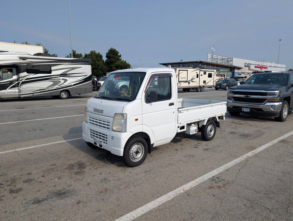 White Suzuki Carry kei truck at the Vancouver ferry terminal