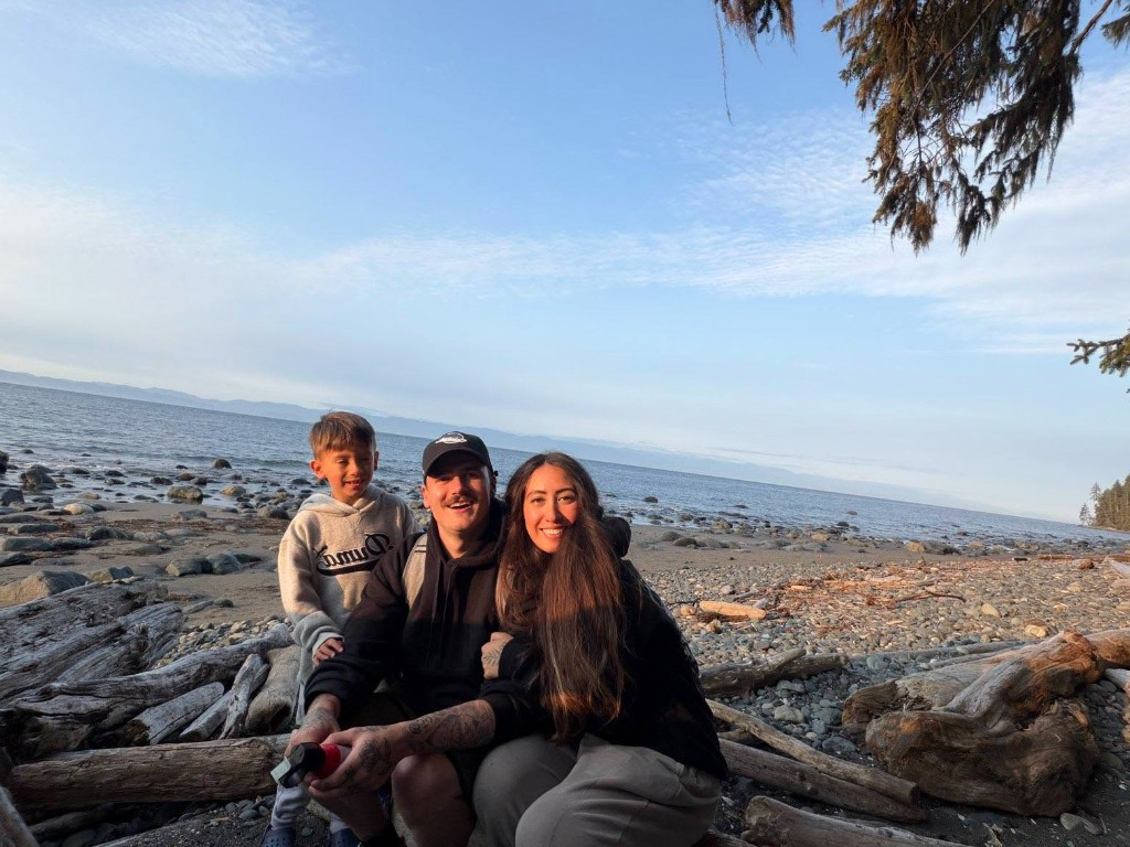 Kody with his son Isaiah and fiancée Sarah on a Vancouver Island beach